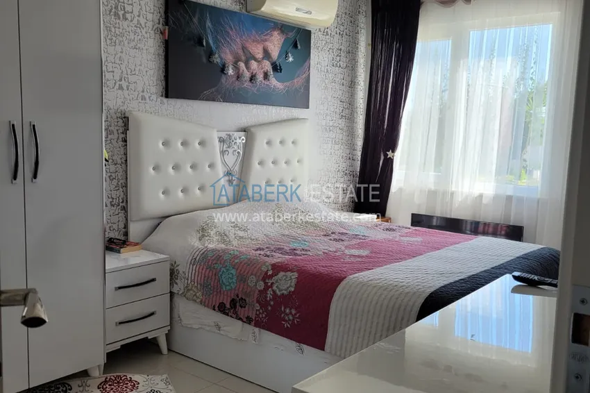 Приобрести Квартира с выходом в сад и застеклённым балконом в Оба в уютном жилом комплексе 12 