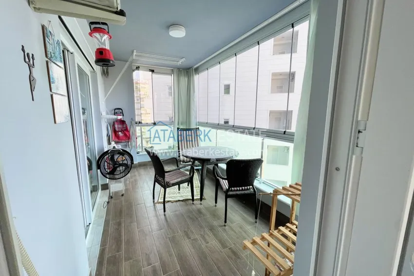 Приобрести Квартира в Махмутларе с мебелью и застеклённым балконом в молодом современном комплексе 12 