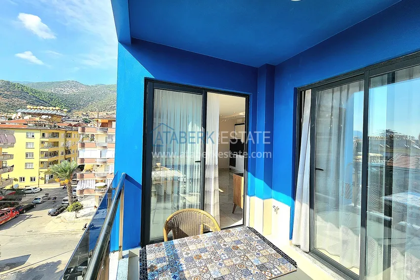 Приобрести Двухкомнатная меблированная квартира с видом на горы в Алании, районе пляжа Клеопатра 14 