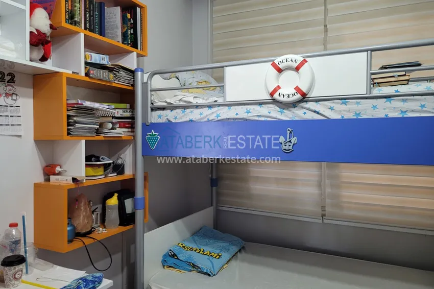 Приобрести Квартира с выходом в сад и застеклённым балконом в Оба в уютном жилом комплексе 13 