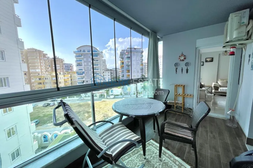 Приобрести Квартира в Махмутларе с мебелью и застеклённым балконом в молодом современном комплексе 13 