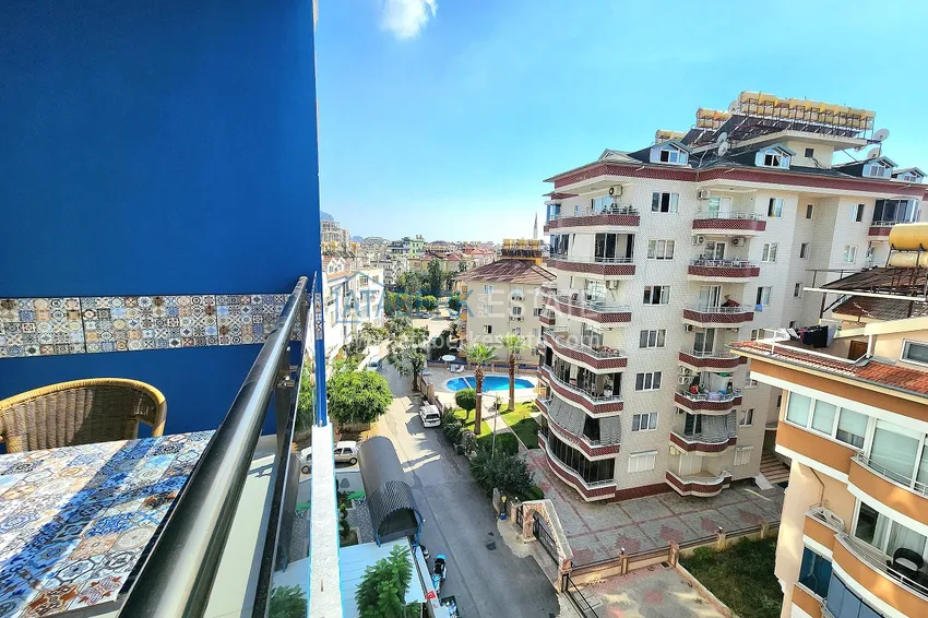 Приобрести Двухкомнатная меблированная квартира с видом на горы в Алании, районе пляжа Клеопатра 15 