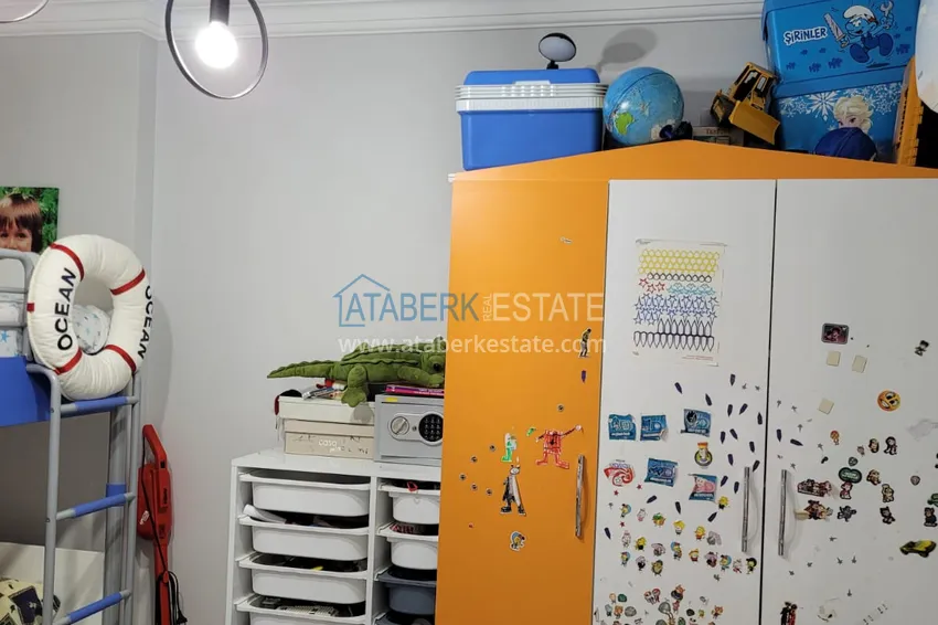 Приобрести Квартира с выходом в сад и застеклённым балконом в Оба в уютном жилом комплексе 14 