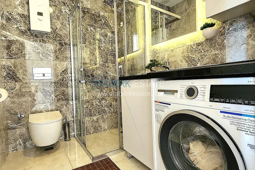 Приобрести Двухкомнатная меблированная квартира с видом на горы в Алании, районе пляжа Клеопатра 17 