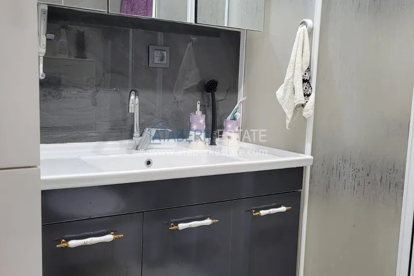 Приобрести Квартира с выходом в сад и застеклённым балконом в Оба в уютном жилом комплексе 16 