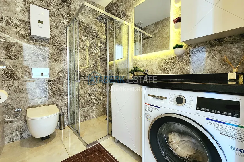 Приобрести Двухкомнатная меблированная квартира с видом на горы в Алании, районе пляжа Клеопатра 18 