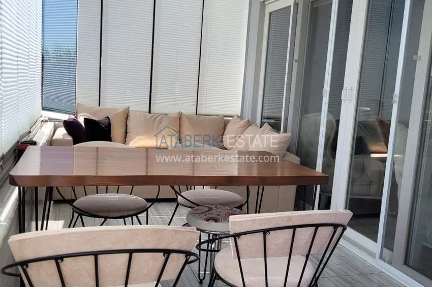 Приобрести Квартира с выходом в сад и застеклённым балконом в Оба в уютном жилом комплексе 17 