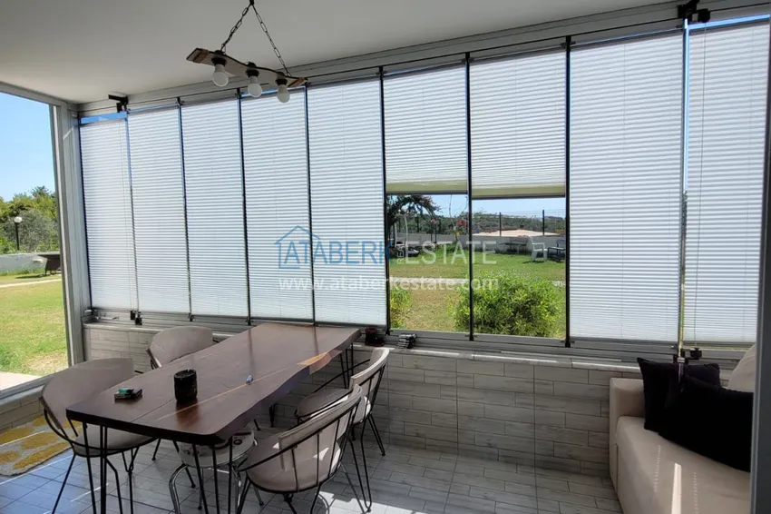 Приобрести Квартира с выходом в сад и застеклённым балконом в Оба в уютном жилом комплексе 18 