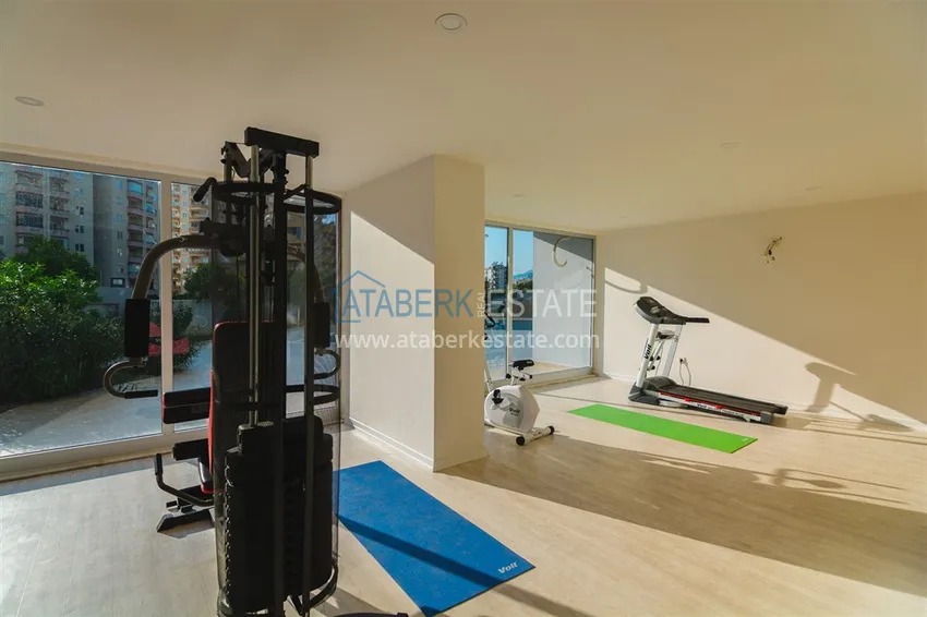 Квартира в Махмутларе с мебелью и застеклённым балконом в молодом современном комплексе 23 