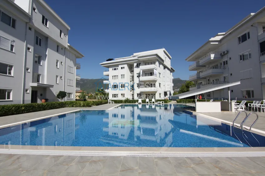 Квартира с выходом в сад и застеклённым балконом в Оба в уютном жилом комплексе 5 