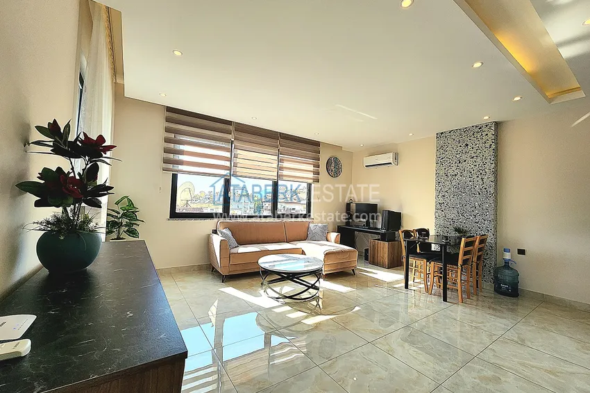 Приобрести Двухкомнатная меблированная квартира с видом на горы в Алании, районе пляжа Клеопатра 2 