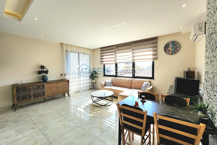 Приобрести Двухкомнатная меблированная квартира с видом на горы в Алании, районе пляжа Клеопатра 4 