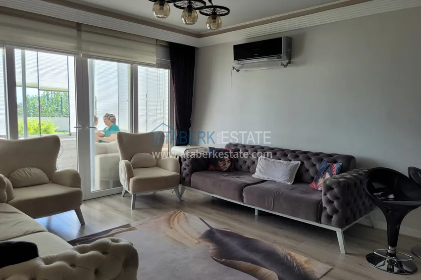 Приобрести Квартира с выходом в сад и застеклённым балконом в Оба в уютном жилом комплексе 4 