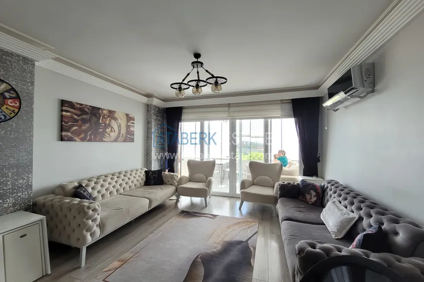 Приобрести Квартира с выходом в сад и застеклённым балконом в Оба в уютном жилом комплексе 5 