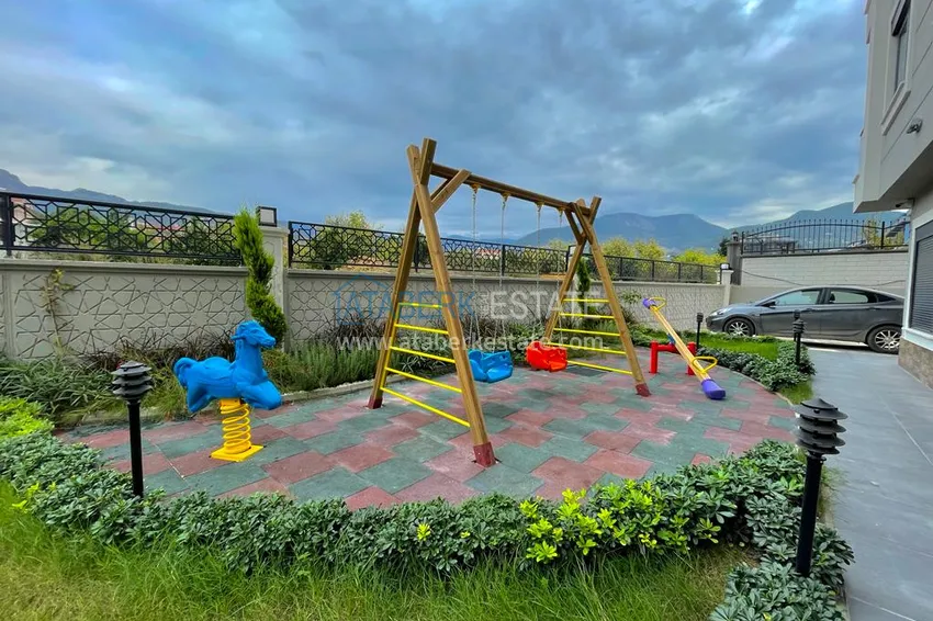 Квартира с выходом в сад, видом на горы и новой мебелью в районе Оба - Алания 6