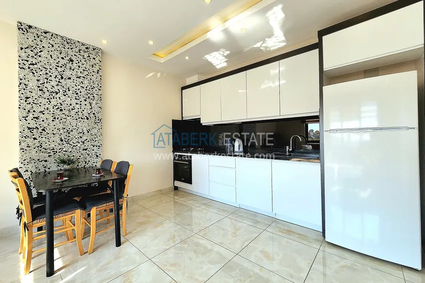 Приобрести Двухкомнатная меблированная квартира с видом на горы в Алании, районе пляжа Клеопатра 8 