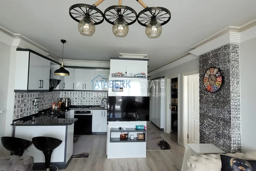 Приобрести Квартира с выходом в сад и застеклённым балконом в Оба в уютном жилом комплексе 7 