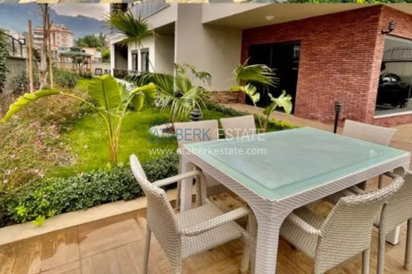 Квартира с выходом в сад, видом на горы и новой мебелью в районе Оба - Алания 9