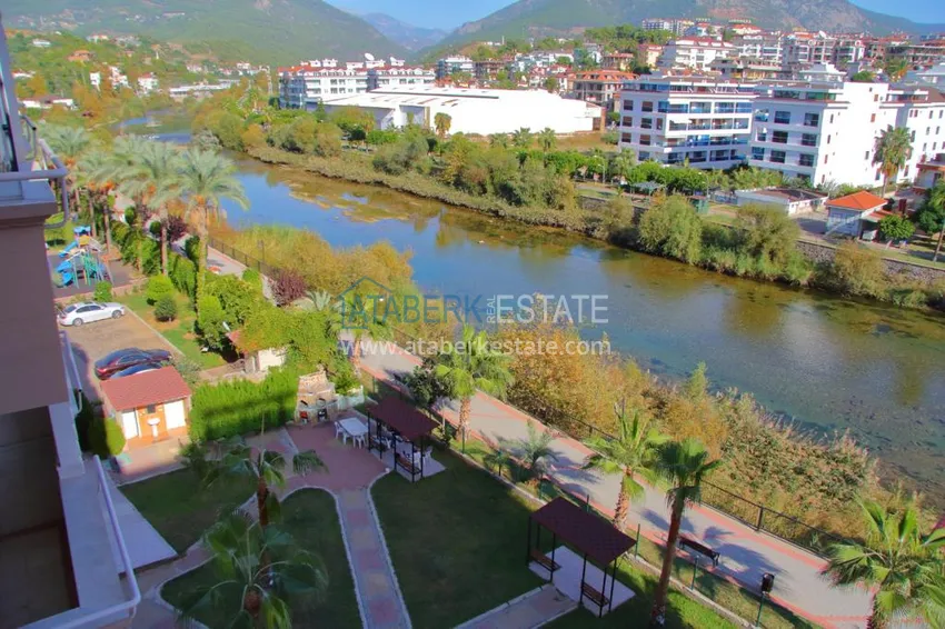 Приобрести Двухэтажная квартира в районе Тосмур с мебелью в комплексе на берегу горной реки  11 