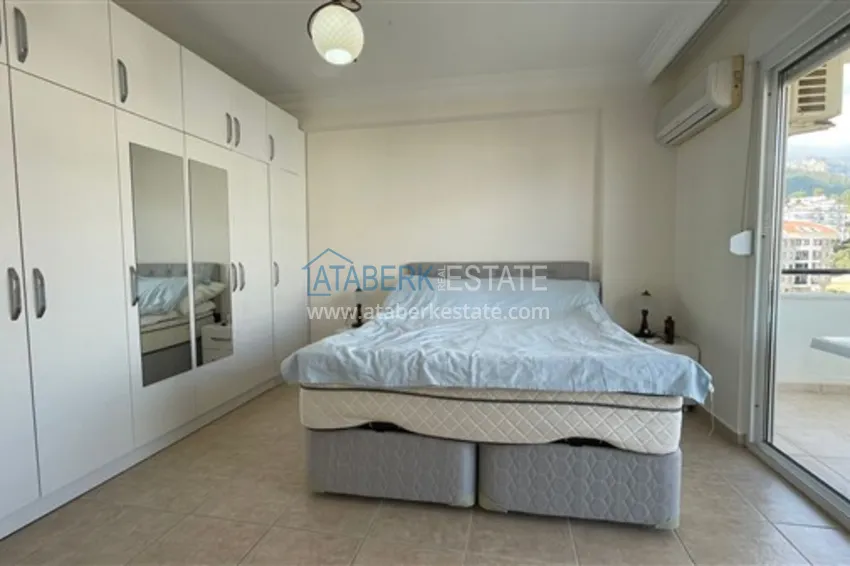 Приобрести Квартира с двумя спальнями и видом на горы и море, район Джиджилли - Алания 11 