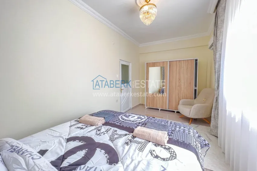 Приобрести Двухкомнатная квартира на берегу моря с новой мебелью - первая линия Махмутлар 12