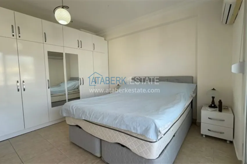 Приобрести Квартира с двумя спальнями и видом на горы и море, район Джиджилли - Алания 12 