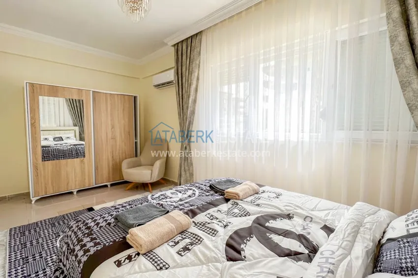 Приобрести Двухкомнатная квартира на берегу моря с новой мебелью - первая линия Махмутлар 13