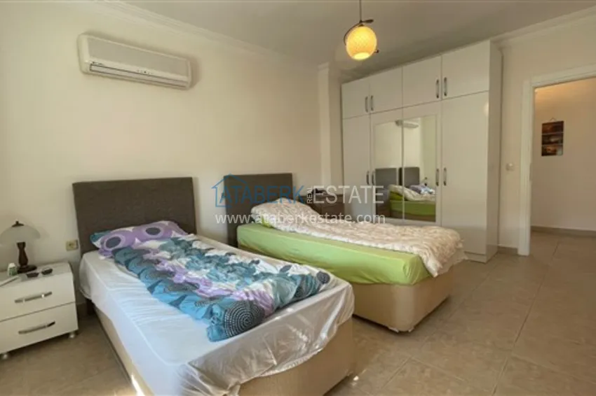 Приобрести Квартира с двумя спальнями и видом на горы и море, район Джиджилли - Алания 13 