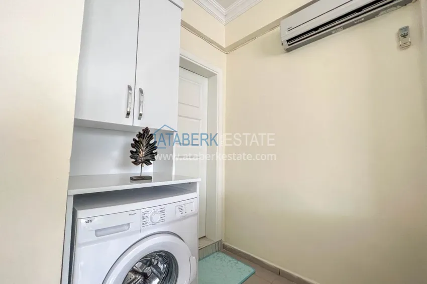 Приобрести Двухкомнатная квартира на берегу моря с новой мебелью - первая линия Махмутлар 14