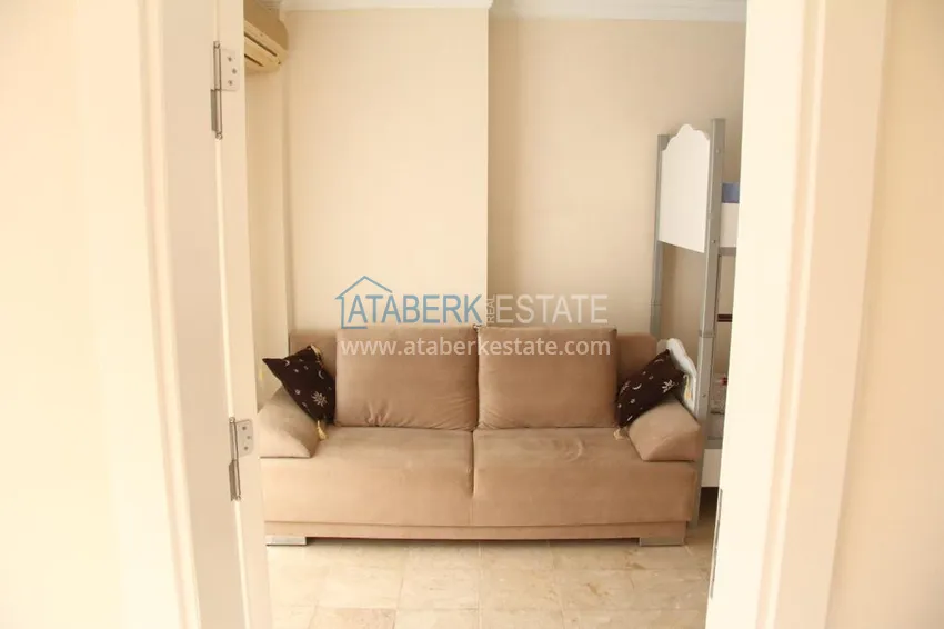 Приобрести Двухэтажная квартира в районе Тосмур с мебелью в комплексе на берегу горной реки  15 