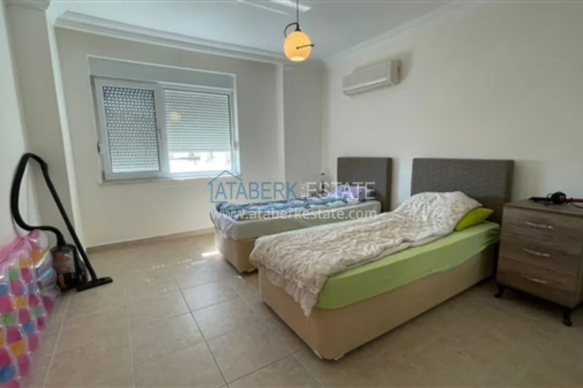 Приобрести Квартира с двумя спальнями и видом на горы и море, район Джиджилли - Алания 14 