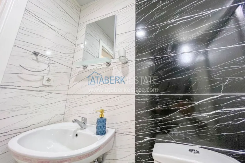 Приобрести Двухкомнатная квартира на берегу моря с новой мебелью - первая линия Махмутлар 16