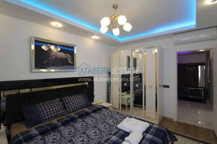 Приобрести Квартира в районе Тосмур двухкомнатная с современной мебелью и застекленным балконом 12 