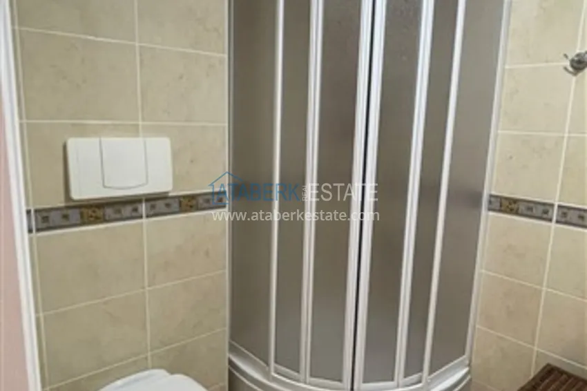 Приобрести Квартира с двумя спальнями и видом на горы и море, район Джиджилли - Алания 18 