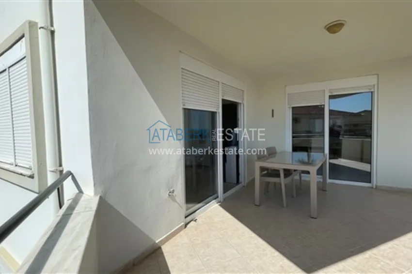 Приобрести Квартира с двумя спальнями и видом на горы и море, район Джиджилли - Алания 21 