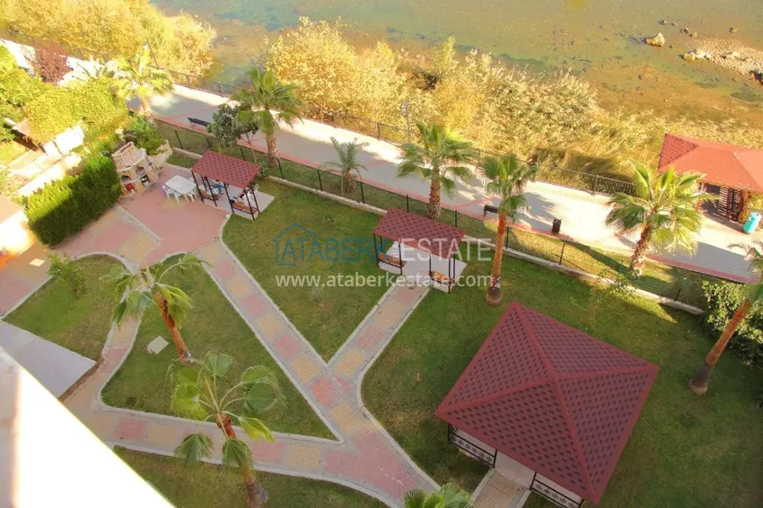 Приобрести Двухэтажная квартира в районе Тосмур с мебелью в комплексе на берегу горной реки  25 