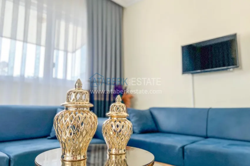 Приобрести Двухкомнатная квартира на берегу моря с новой мебелью - первая линия Махмутлар 5