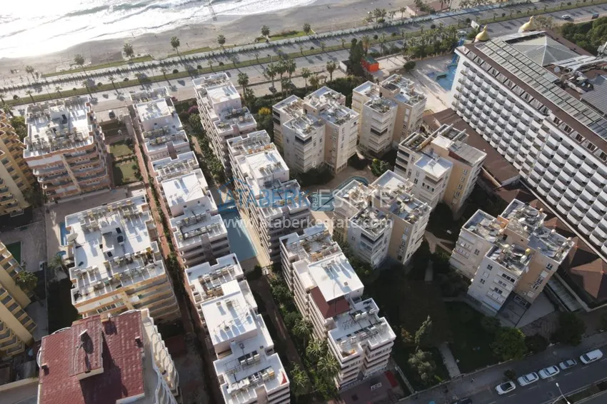 Двухкомнатная квартира на берегу моря с новой мебелью - первая линия Махмутлар 9