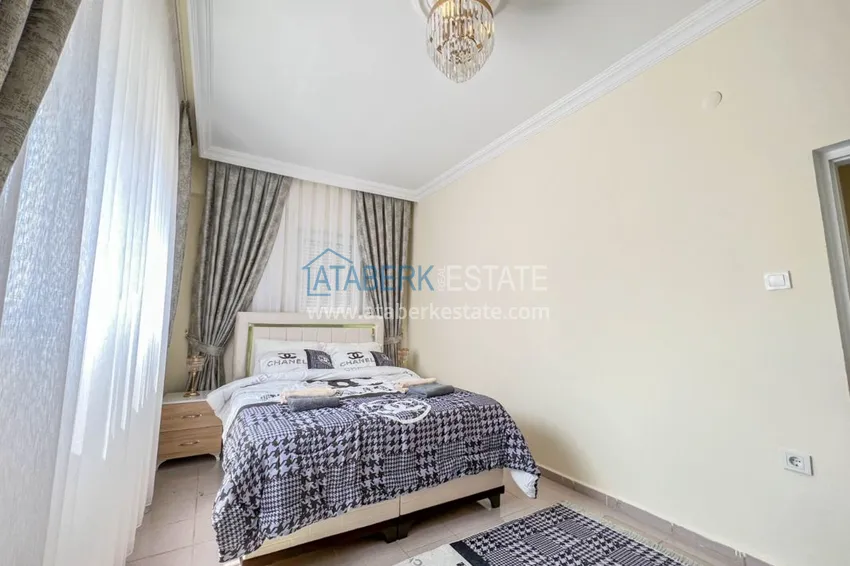 Приобрести Двухкомнатная квартира на берегу моря с новой мебелью - первая линия Махмутлар 10