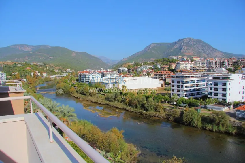 Приобрести Двухэтажная квартира в районе Тосмур с мебелью в комплексе на берегу горной реки  10 