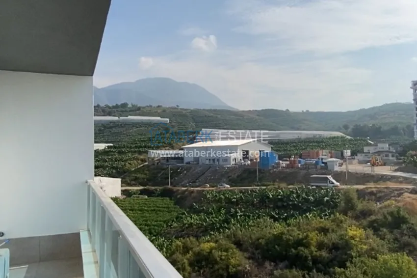 Приобрести Квартира 1+1 в Махмутларе меблированная с видом на горы и море. Мопед в подарок!  19 