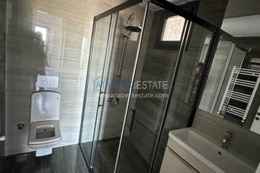 Приобрести Небольшой жилой комплекс в самом сердце Эрдемли, расположенный прямо у моря. 10 