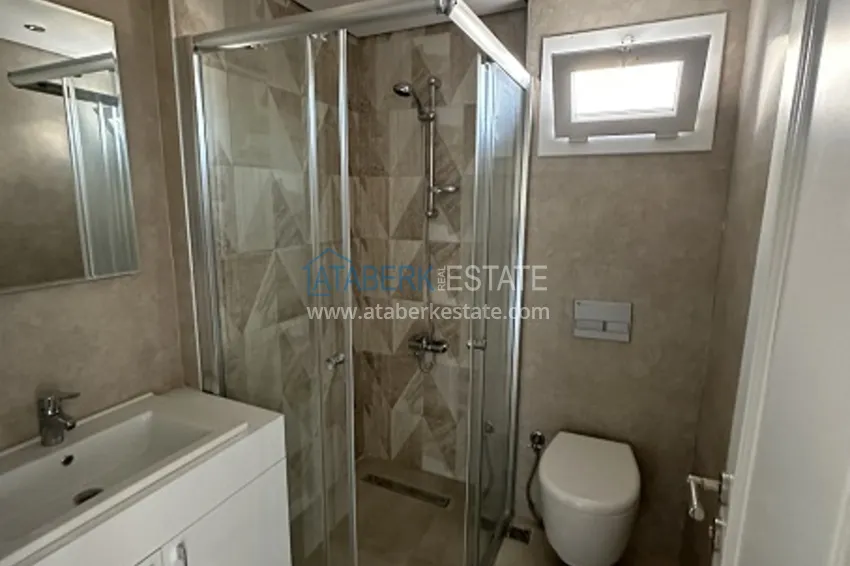 Приобрести Готовые квартиры 2+1 с чистовой отделкой в 100 м от моря, в популярном районе Эрдемли-Мерсин 12