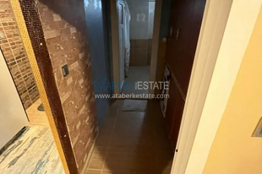 Приобрести Квартира 2+1 с мебелью и отдельной кухней в районе Эрдемли-Томюк 10 