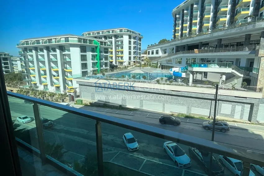 Приобрести Квартира 1+1 с боковым видом на море в элитном комплексе с частным пляжем, Каргыджак – Алания 11 