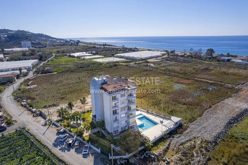 Квартира с дизайнерским интерьером в 200 метрах от моря в районе Алании открытом для ВНЖ - Демирташ 12 