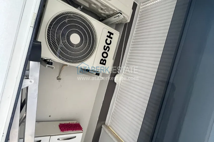 Приобрести Просторная двухкомнатная квартира с тремя застеклёнными балконами в Алании, район Махмутлар 11 