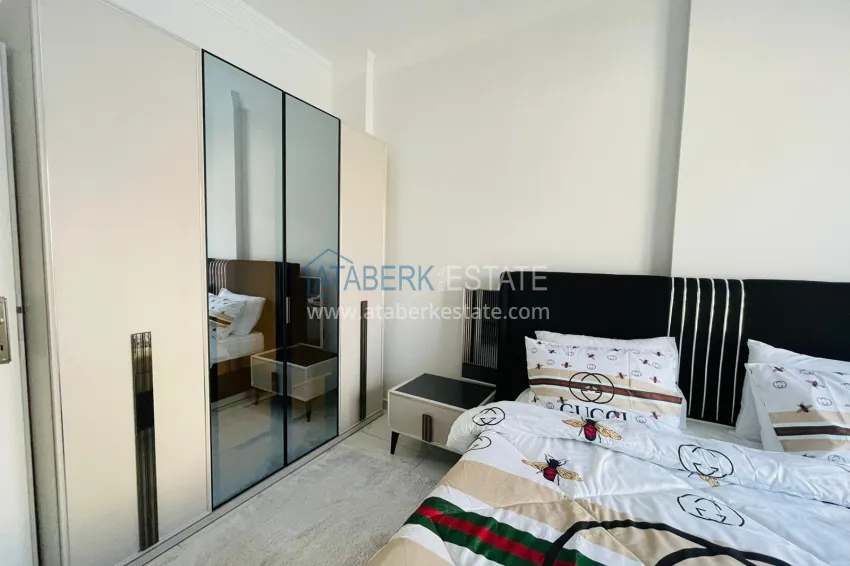 Приобрести Квартира 1+1 в Махмутларе с новой мебелью в молодом комплексе 12 