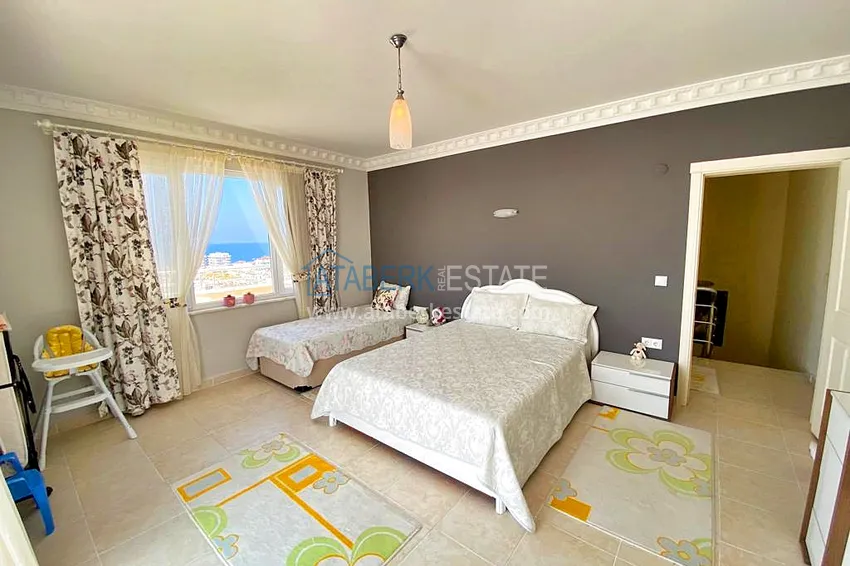 Приобрести Пентхаус-дуплекс 3+1 в Махмутларе с мебелью, застекленным балконом и видом на море 13 