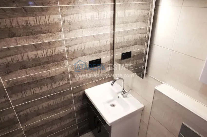 Приобрести Квартира 1+1 с новой мебелью и видом на горы в Алании район Махмутлар 15 